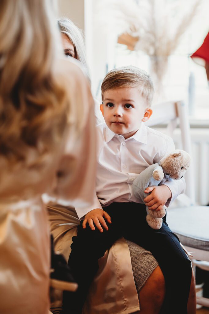 a page boy being entertained before a wedding 