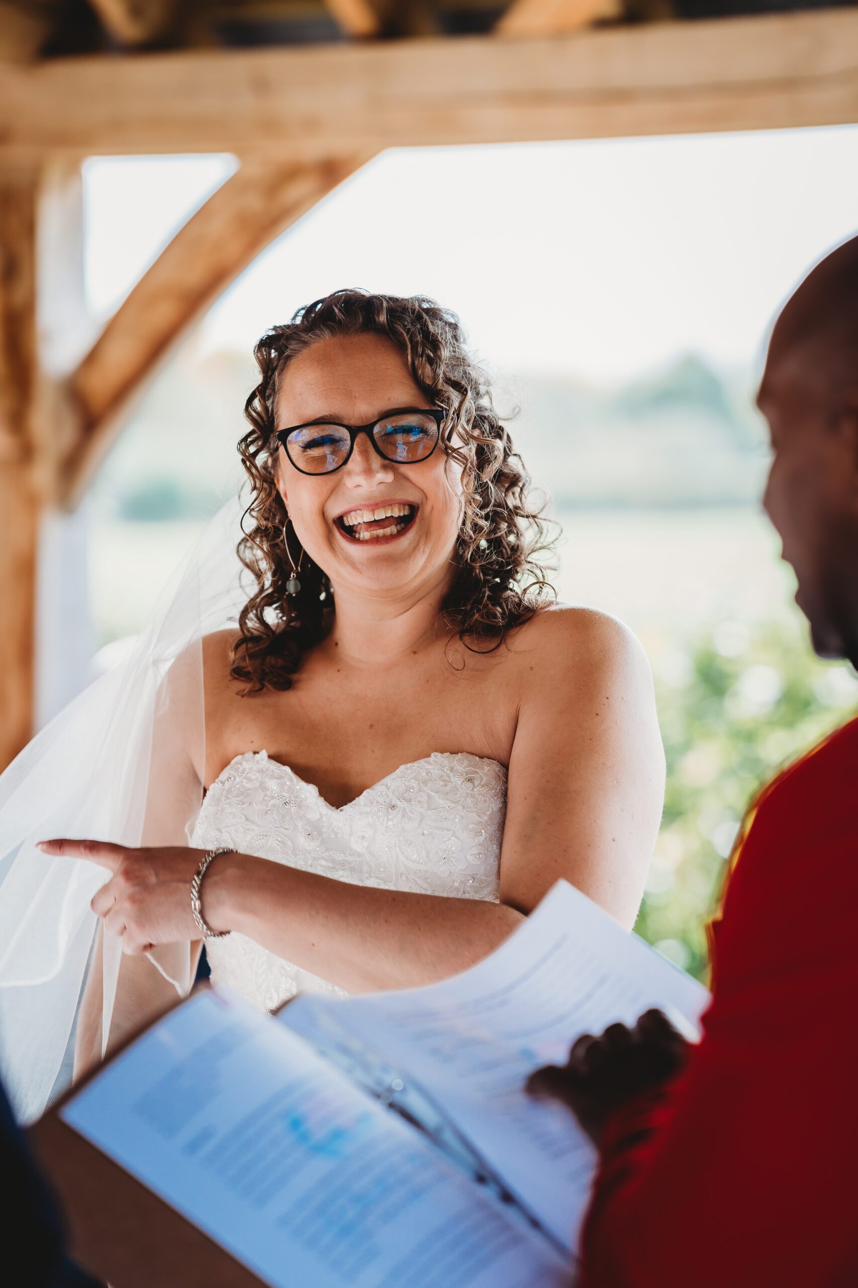 a bride laughing during her wedding taken by a celebrant 