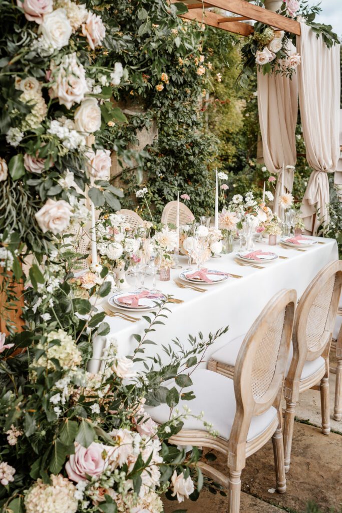 top table at a wedding fully decorated in white and pink flowers taken by a berkshire wedding photographer