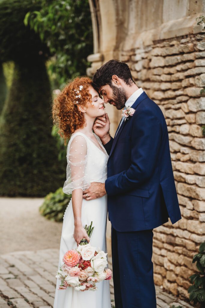 bride and groom cosying up together after their wedding for a euridge manor wedding photographer 