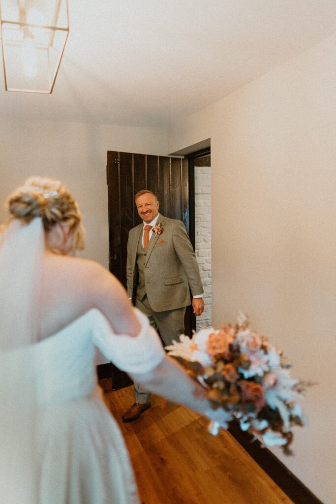 a dads reaction as he sees his daughter for the first time on her wedding day