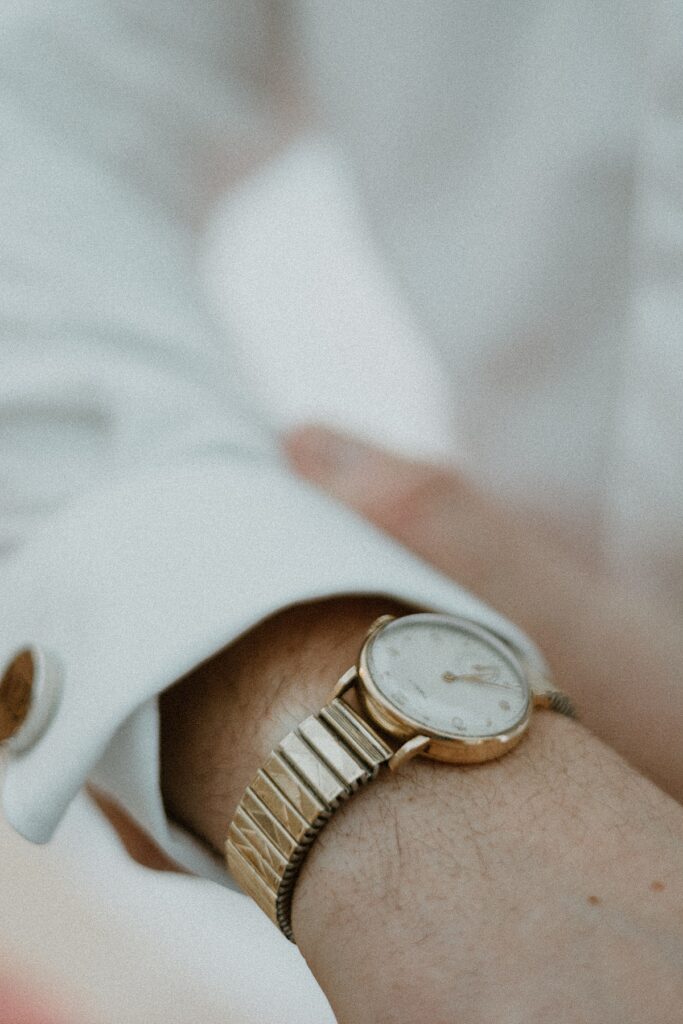 a close up of a grooms watch during groom prep