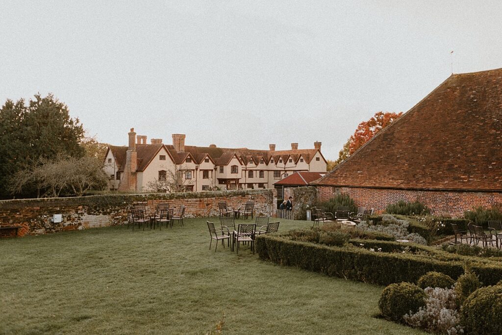 ufton courts barn with the manor house in the background