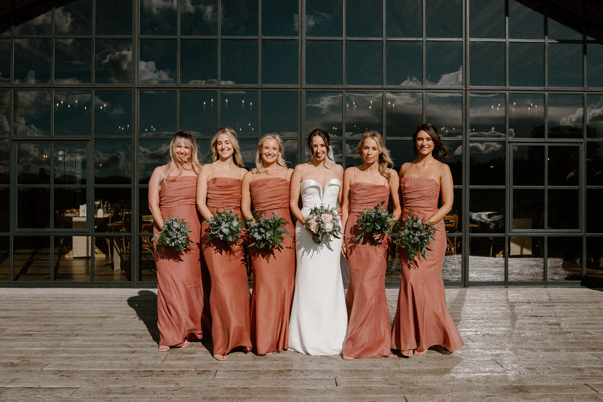 bridal party lined up for a more traditional group shot for a surrey wedding photographer