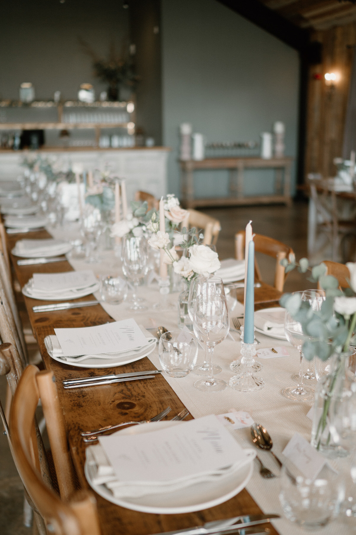 a fully decorated wedding table with a cream, pink and green colour theme