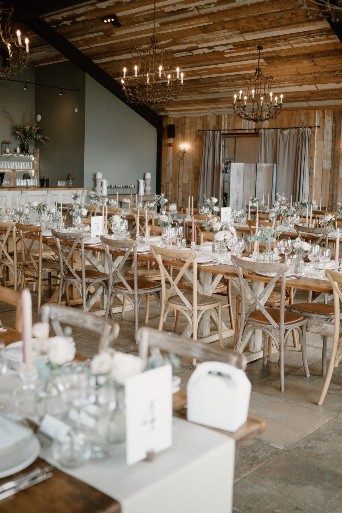 a cream themed table setting ready for a wedding breakfast