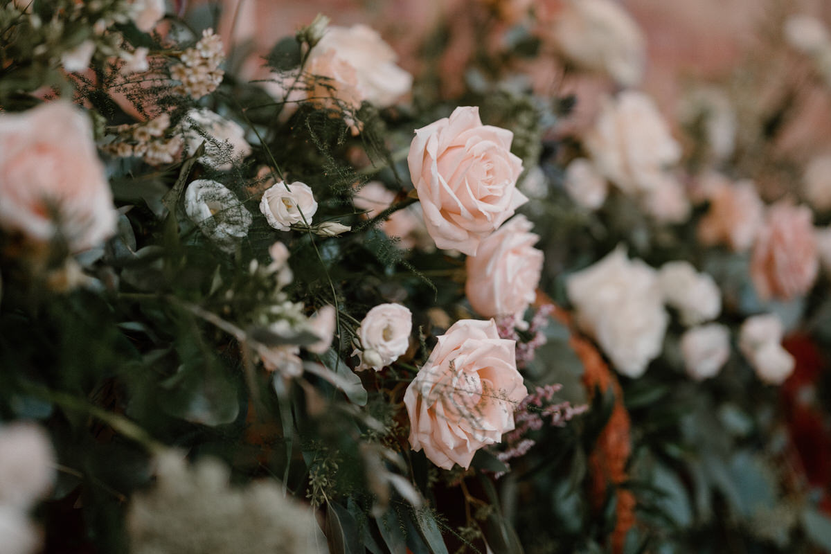 a wedding bouquet of flowers full of pink and cream roses