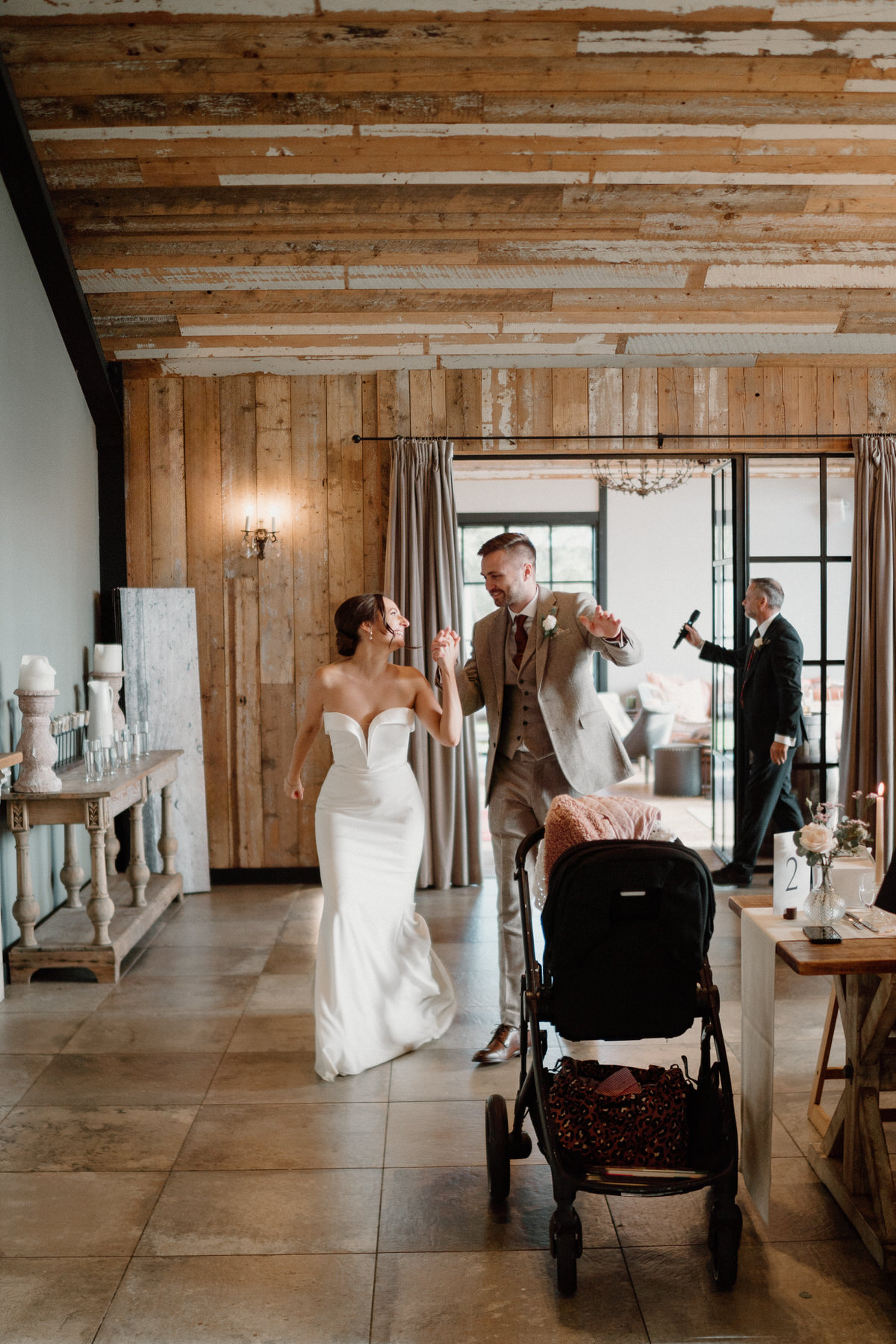 bride and groom enter their wedding meal dancing and singing at botley Hill Barn