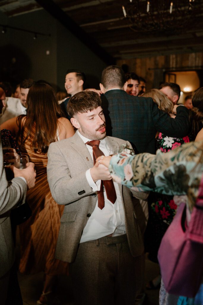 a guest dancing during a wedding reception at a luxury wedding venue