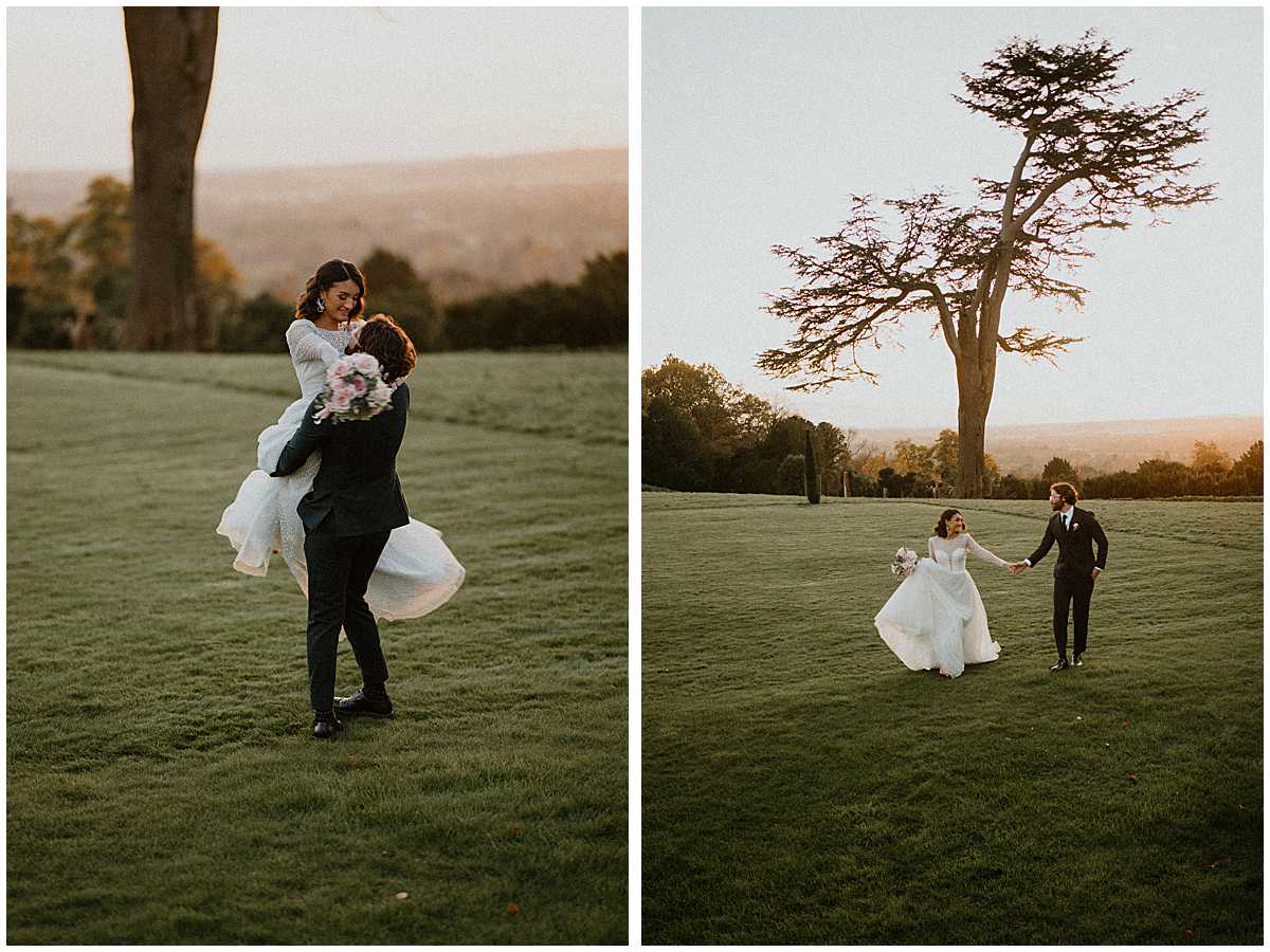 a bride and groom celebrating the end of the day at sunset on the venue lawns