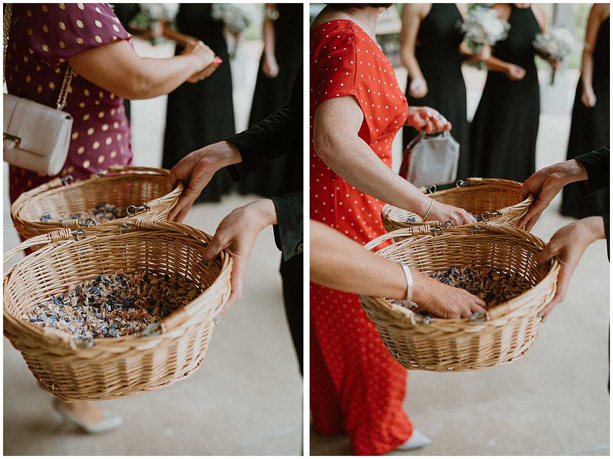 wedding guests getting the rose confetti ready for the bride and groom