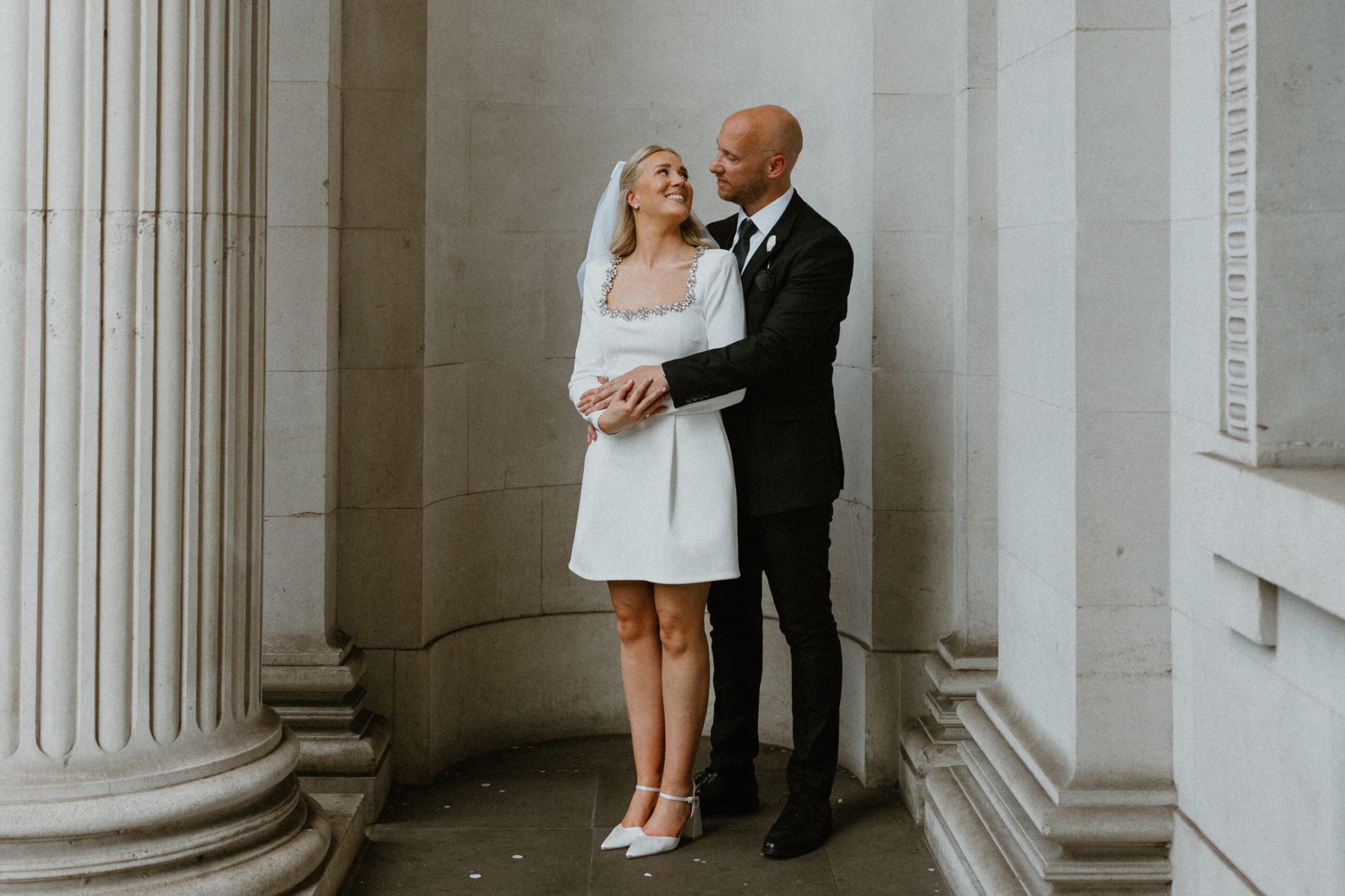 couples portraits outside of Old Marleybone town hall taken by a london wedding photographer